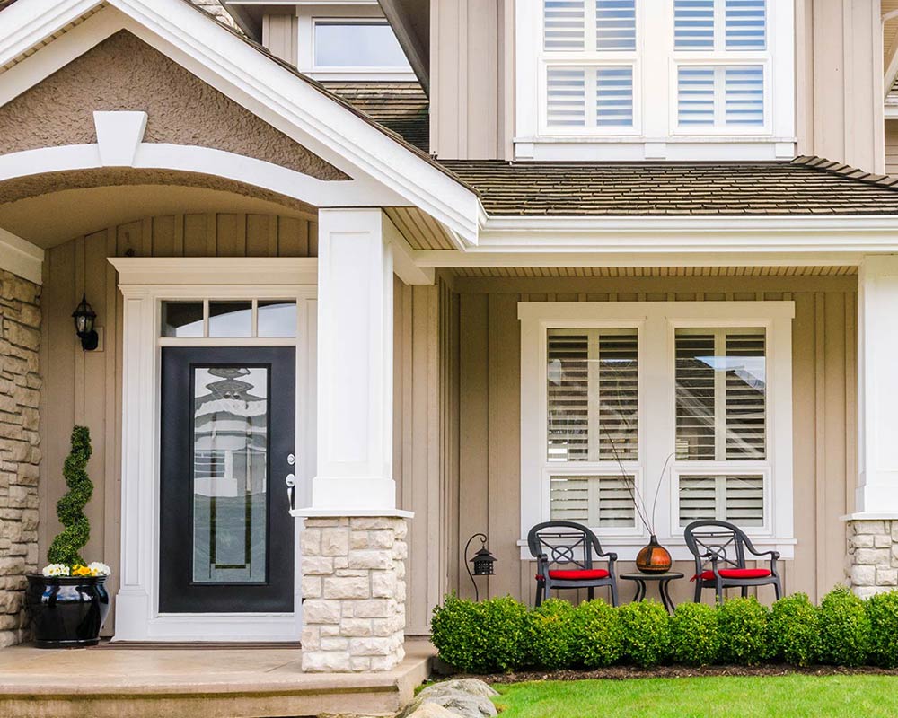 front of tan home with many windows fort collins co