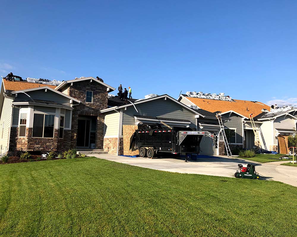 residential roof being worked on loveland co